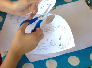 A ten year old creates her vision of Alice for a take of Alice in Wonderland. The Italian kids were completely absorbed in the artistic craft activities.